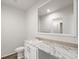 Small bathroom with single vanity and toilet at 165 S County Road 197, Byers, CO 80103