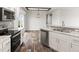 Open concept kitchen with island and access to the dining area at 165 S County Road 197, Byers, CO 80103