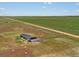 Aerial view of property with home and shop, showcasing land at 165 S County Road 197, Byers, CO 80103