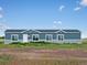House exterior, gray with white accents at 165 S County Road 197, Byers, CO 80103