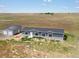 Aerial view of house and detached garage at 165 S County Road 197, Byers, CO 80103