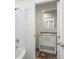 Small bathroom with single vanity and bathtub at 165 S County Road 197, Byers, CO 80103