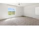 Living room featuring neutral carpeting and a ceiling fan at 165 S County Road 197, Byers, CO 80103