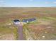 Aerial view showing home, shop, and expansive property at 165 S County Road 197, Byers, CO 80103