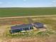Aerial view of a home and detached shop on acreage at 165 S County Road 197, Byers, CO 80103