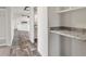 Hallway with view into kitchen and built-in bench at 165 S County Road 197, Byers, CO 80103
