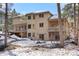 House exterior with landscaping and snowy yard at 19815 W Top O The Moor Dr, Monument, CO 80132