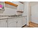 Efficient kitchen with white cabinets and a double sink at 1599 W Beekman Pl Pl, Denver, CO 80221