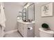 Double vanity bathroom with gray cabinets and modern fixtures at 1649 S Ivory Cir # D, Aurora, CO 80017