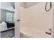 Clean bathroom with shower/tub combo, and a view of a bedroom at 1649 S Ivory Cir # D, Aurora, CO 80017