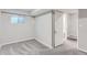 Finished basement room with grey carpeting and access to a bathroom at 1649 S Ivory Cir # D, Aurora, CO 80017