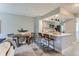 Eat-in kitchen with breakfast bar and modern finishes at 1649 S Ivory Cir # D, Aurora, CO 80017