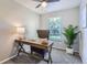 Bright home office with a wooden desk and comfortable chair at 1649 S Ivory Cir # D, Aurora, CO 80017