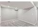 Spacious finished basement room with grey carpeting at 1649 S Ivory Cir # D, Aurora, CO 80017