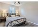 Cozy bedroom with a floral comforter and bedside tables at 1649 S Ivory Cir # D, Aurora, CO 80017