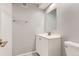 Basement bathroom with white vanity and tiled shower at 1649 S Ivory Cir # D, Aurora, CO 80017
