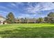 Spacious community green area with townhomes in the background at 1649 S Ivory Cir # D, Aurora, CO 80017