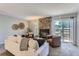 Living area showcasing a stone fireplace and sliding glass doors at 1649 S Ivory Cir # D, Aurora, CO 80017