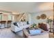Bright living room with comfy seating, a fireplace, and access to a patio at 1649 S Ivory Cir # D, Aurora, CO 80017