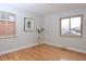 Well-lit bedroom with hardwood floors and a window at 3534 N Glencoe St, Denver, CO 80207