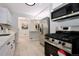 Modern kitchen with stainless steel appliances and white cabinets at 3534 N Glencoe St, Denver, CO 80207