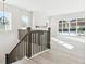 Staircase and upstairs landing overlooking the open living area at 4711 Twelve Oaks Way, Castle Rock, CO 80104