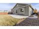 Landscaped backyard with patio, gravel, and grass areas at 9567 Dahlia Ln, Thornton, CO 80229