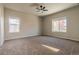 Spacious bedroom with neutral carpeting and ceiling fan at 9567 Dahlia Ln, Thornton, CO 80229