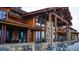 Mountain lodge style clubhouse with large windows and patio seating at 3015 Newfound Lake Rd, Berthoud, CO 80513