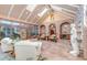 Bright sunroom with high ceilings, skylights, and comfortable seating at 28 Indian Paintbrush Dr, Golden, CO 80401