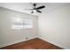 Bright bedroom with hardwood floors and ceiling fan at 2996 S Sheridan Blvd, Denver, CO 80227