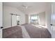 Spacious bedroom with large window and sliding barn door at 37057 Still Rock Pt, Elizabeth, CO 80107