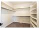 Large walk-in closet with shelves and hanging rods at 37057 Still Rock Pt, Elizabeth, CO 80107