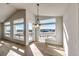 Bright dining room with hardwood floors and large windows offering scenic views at 37057 Still Rock Pt, Elizabeth, CO 80107
