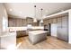 Modern kitchen with an island and stainless steel appliances at 37057 Still Rock Pt, Elizabeth, CO 80107