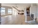 Open concept living room with hardwood floors and kitchen views at 37057 Still Rock Pt, Elizabeth, CO 80107