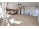 Spacious living room with hardwood floors and a stone fireplace at 37057 Still Rock Pt, Elizabeth, CO 80107