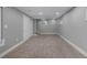 Finished basement with neutral carpeting and ample storage at 4740 E Yale Ave, Denver, CO 80222