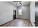 Simple bedroom with wood-look flooring and large window at 133 Adams Way, Breckenridge, CO 80424