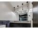 Modern bathroom with dark vanity, blue tile, and pendant lighting at 133 Adams Way, Breckenridge, CO 80424