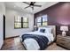 Comfortable bedroom with a queen bed and wood flooring at 133 Adams Way, Breckenridge, CO 80424