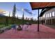 Large patio with fire pit and hot tub, mountain views at 133 Adams Way, Breckenridge, CO 80424