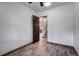 Small bedroom with wood-look flooring and access to hallway at 133 Adams Way, Breckenridge, CO 80424