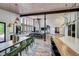 Open dining area with wood table and green velvet chairs at 133 Adams Way, Breckenridge, CO 80424