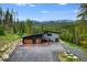 Modern home exterior with a two-car garage and mountain backdrop at 133 Adams Way, Breckenridge, CO 80424