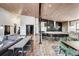 Open concept kitchen with island, stainless steel appliances, and wood flooring at 133 Adams Way, Breckenridge, CO 80424