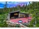 Aerial view showcasing a modern home's exterior and mountain views at 133 Adams Way, Breckenridge, CO 80424
