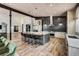 Modern kitchen features a large island, stainless steel appliances, and wood cabinets at 133 Adams Way, Breckenridge, CO 80424