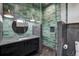 Modern bathroom with green tile, walk-in shower, and floating vanity at 133 Adams Way, Breckenridge, CO 80424