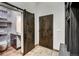 Contemporary half bathroom with patterned tile and barn door at 133 Adams Way, Breckenridge, CO 80424
